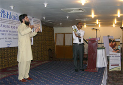 Akram Showing catlog of assistive devices developed in Thailand