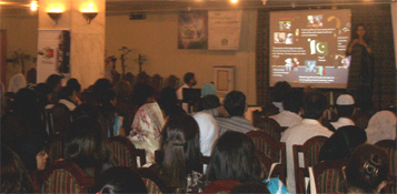 Zara Husain giving a presentaiton